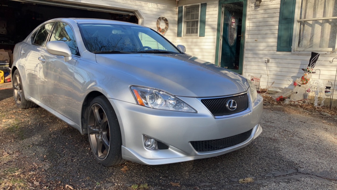 Shiny silver Lexus sedan after receiving an exterior detailing service.